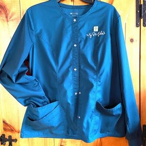 St Luke’s Medical Assistant Teal Blue scrub jacket.